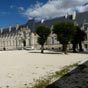 L'Abbaye Royale: Fonde en 817 par Ppin, roi d'Aquitaine, petit-fils de Charlemagne, quand il reut un crne prsent comme tant celui de saint Jean-Baptiste. La premire abbaye fut  plusieurs reprises pille par les Vikings. La relique, cache, fut retrouve en 101o, et le duc Guillaume fit reconstruire un monastre qui, grce aux dons et aux offrandes de milliers de plerins, devint une des plus puissantes abbayes de l'Ouest de la France. La guerre de Cent Ans mit un terme  l'essor de l'abbaye qui, situe comme la ville dans une rgion convoite par les belligrants, fut  plusieurs reprises pille et saccage.