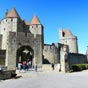 Ds 1850, les restaurations d'Eugne Viollet-le-Duc sont fortement critiques. Ses dtracteurs, comme Hippolyte Taine, dnoncent la diffrence entre les parties neuves et les parties en ruine considrant que ces dernires ont plus de charme. D'autres, comme Achille Rouquet ou Franois de Neufchteau, regrettent le caractre trop gothique et le style  Viollet-le-Duc  des modifications. Aujourd'hui, les historiens soulignent surtout les erreurs du restaurateur. Joseph Poux regrette la mauvaise reconstitution des portes et des fentres des tours wisigothes et la bretche de la porte de l'Aude. Mais ce sont surtout les choix effectus pour la restauration des toitures qui furent fortement critiqus. Viollet-le-Duc, fort de ses expriences de restauration sur les chteaux du nord de la France, choisit de coiffer les tours d'une toiture conique couverte d'ardoises, contrastant avec les toitures plates couvertes de tuiles romanes des chteaux de la rgion. Ce choix avait pour lui une logique historique, car Simon de Monfort et les autres chevaliers qui participrent  la croisade des Albigeois venaient tous du Nord. Il n'est pas impossible que ces  nordistes  aient ramen avec eux leurs propres architectes et techniques. Malgr critiques et dtracteurs, cette ville reste dans la mmoire de tous ceux, y compris plerins, qui ont arpent ses petites rues, long ses remparts, pntr dans son chteau et parcouru le chemin de ronde.