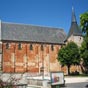 L'glise Saint-Michel  Chrost date du XIIme sicle, elle surprend par sa taille imposante et la teinte rougetre de sa pierre, un calcaire local appel 
