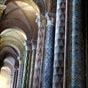 La hardiesse de ces peintures fut trs critique ds la XIXe sicle , notamment par l'crivain Huysmans. Bien qu'assez fantaisistes ces peintures rappellent la polychromie qui devait exister dans l'difice  l'poque romane. Le got du XXe sicle, privilgiant la beaut des formes et ses structures brutes, rejette cette esthtique: dans les annes 30, les colonnes du choeur furent dcapes, mettant  nu la pierre