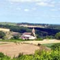 Durfort-Lacapelette : L'glise Saint-Paul-de-Burges est au Sud du village sur le coteau. A vrai dire et malgr son nom, le village n'a pas d'glise.... Cette glise du XIXe sicle a t rebtie  l'emplacement d'une glise du XIIIe sicle. Elle a un choeur  cinq pans. Elle est en pierre mais le portail  voussures en arc bris est en briques, comme le clocheton mur en accolade perc de trois baies. Bien qu'isole, cette glise est considre comme l'glise du village. Brugues est la francisation de Las Brugas, qui en occitan signifiait bruyres, terres incultes occupes par cette vgtation.