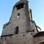 L'glise Sainte-Croix : Le clocher roman est une tour fortifie au-dessus du bas-ct nord.