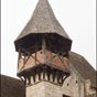 Le clocher de l'glise Notre-Dame montre un clocher dont le dernier tage est construit en colombages...