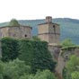 Le chteau de Ruesta aux deux tours carres et creneles, perces d'archres, relies par une brve courtine, semble surveiller toujours le grand lac bourbeux...